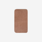 Top view of a dusty rose organic cotton face towel with rounded corners, displayed flat on a white background.
