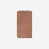 Top view of a dusty rose organic cotton face towel with rounded corners, displayed flat on a white background.