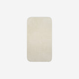 Top view of a beige organic cotton face towel with rounded corners, displayed flat on a white background.