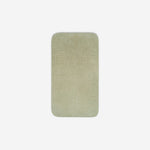 Top view of a light grey organic cotton face towel laid flat with rounded corners, shown on a white background.