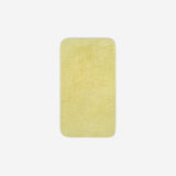 Top view of a yellow cotton face towel laid flat with rounded corners, shown on a white background.