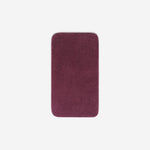 Top view of a purple organic cotton face towel with rounded corners, displayed flat on a white background.